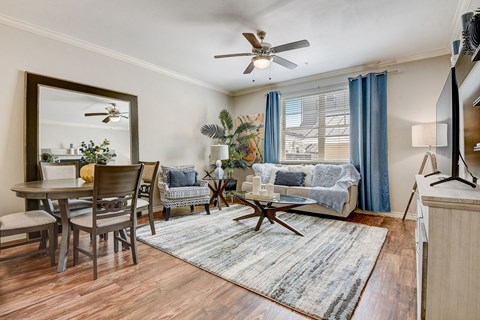 a living room with a couch and a dining room table